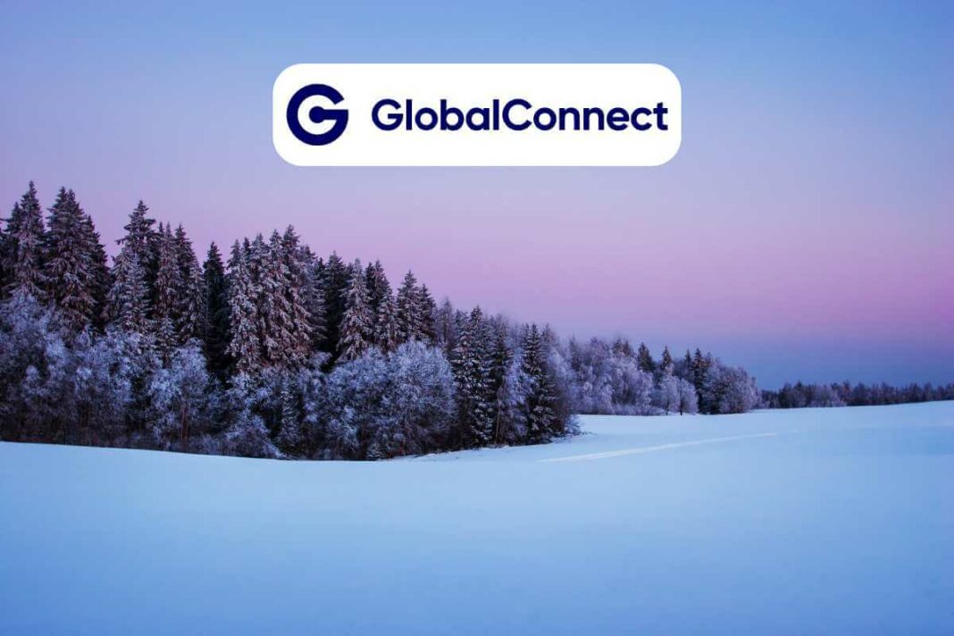 Snowy forest with GlobalConnect logo at dusk.
