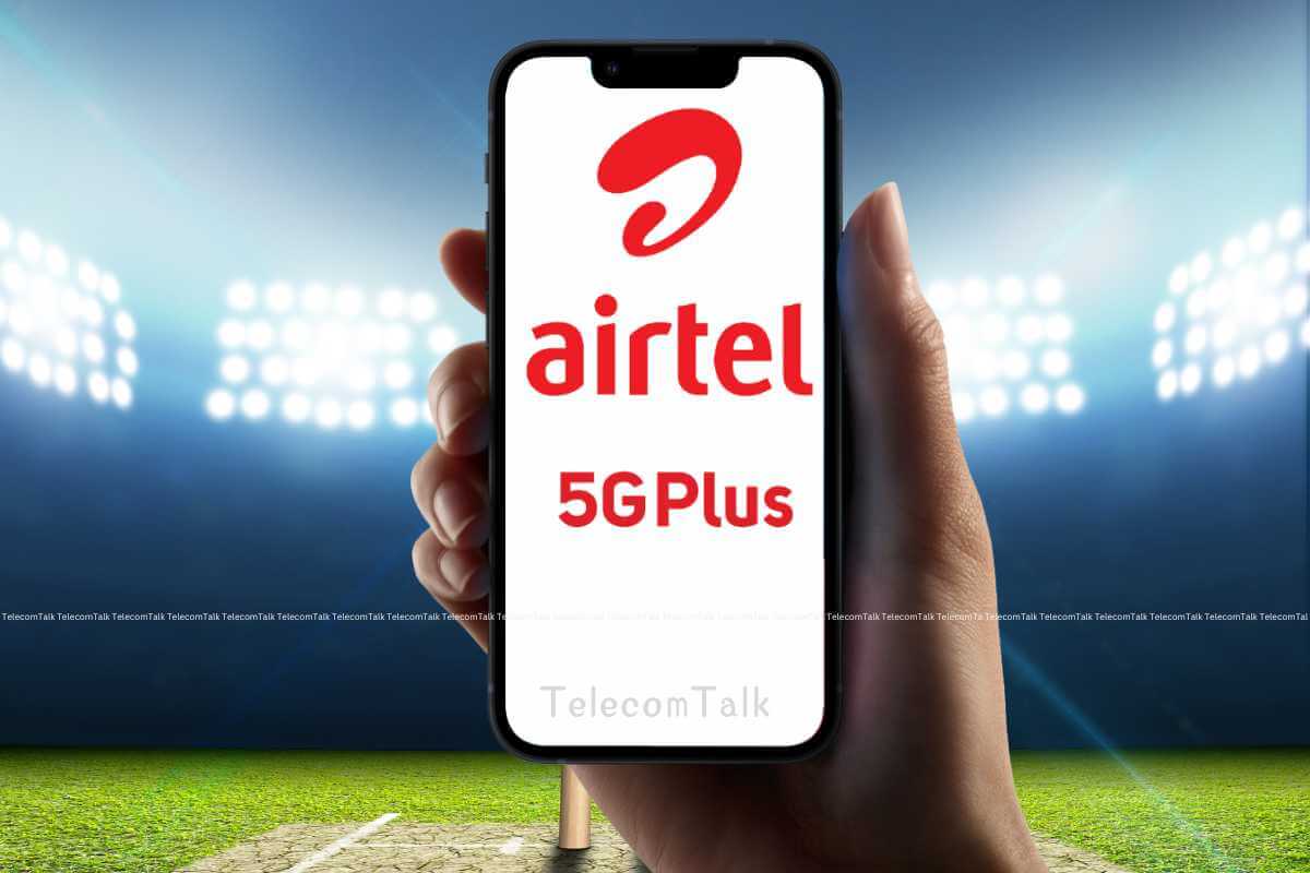 Hand holding smartphone with Airtel 5G Plus logo