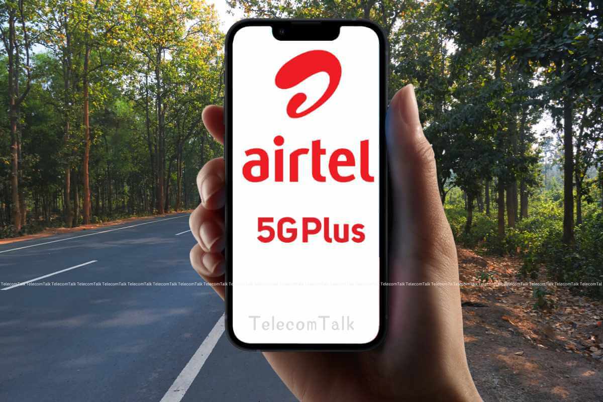 Hand holding phone displaying Airtel 5G Plus outdoors