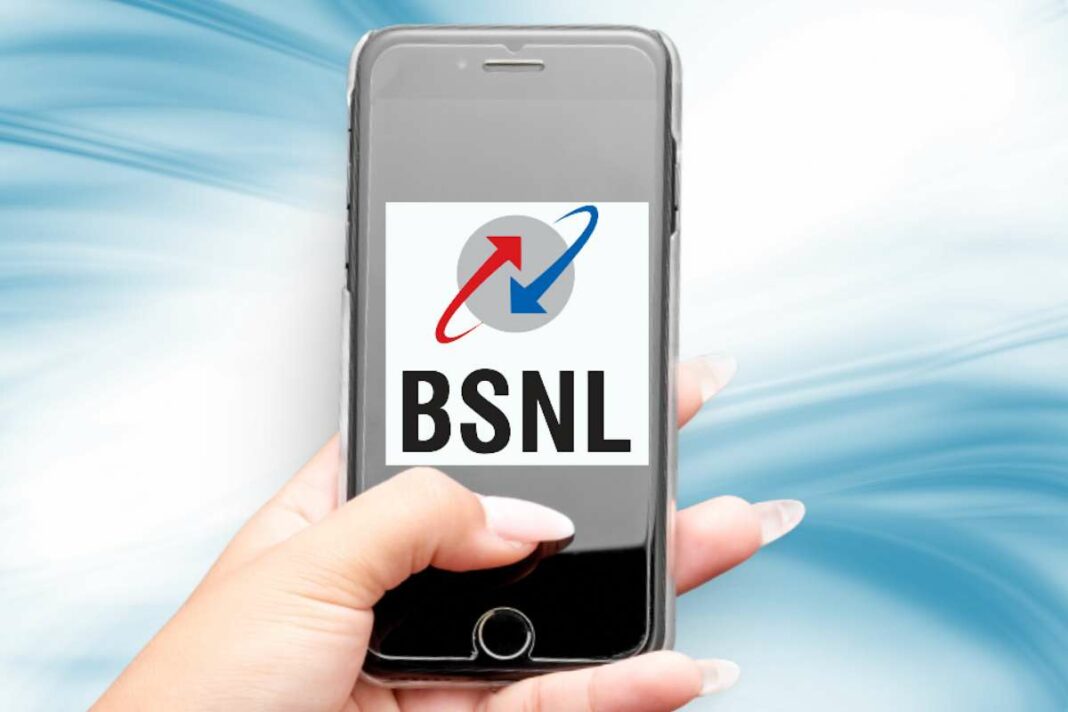 Hand holding smartphone displaying BSNL logo