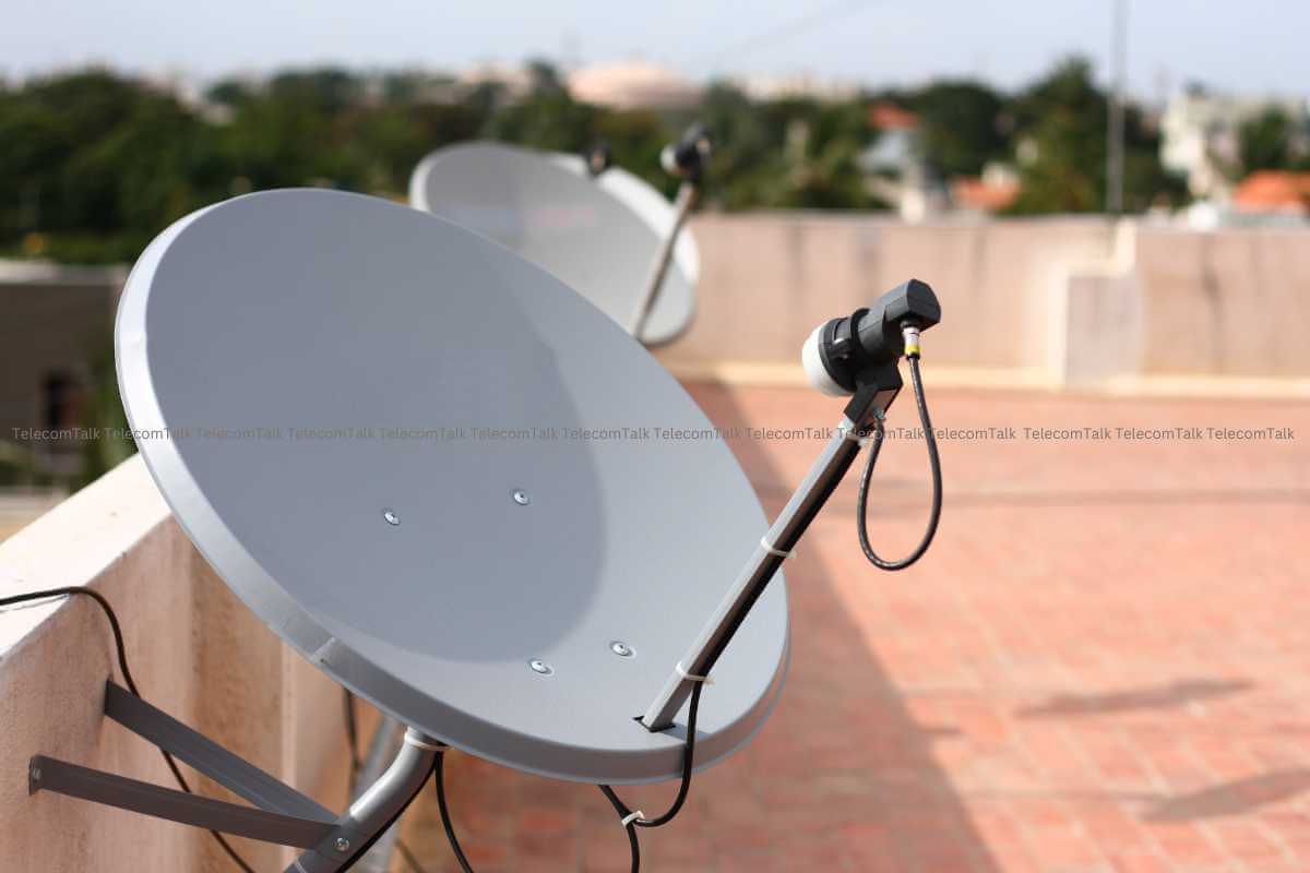 Satellite dishes on a rooftop.