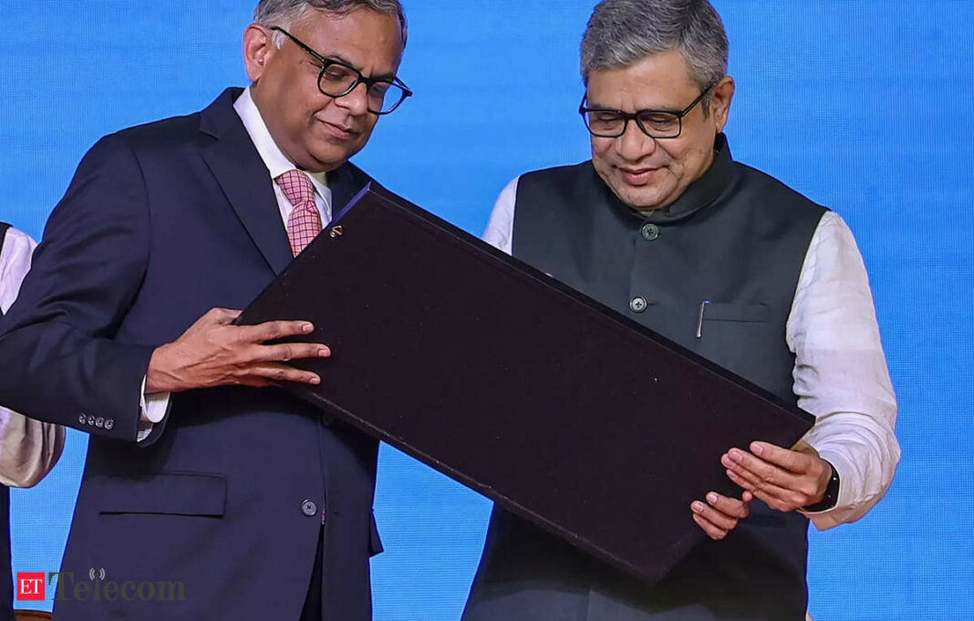 Two men holding an award on stage.