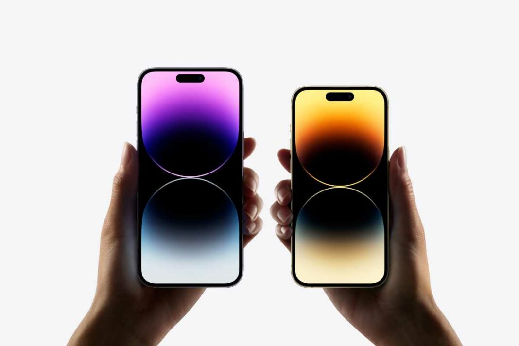 Two smartphones held against white backdrop.