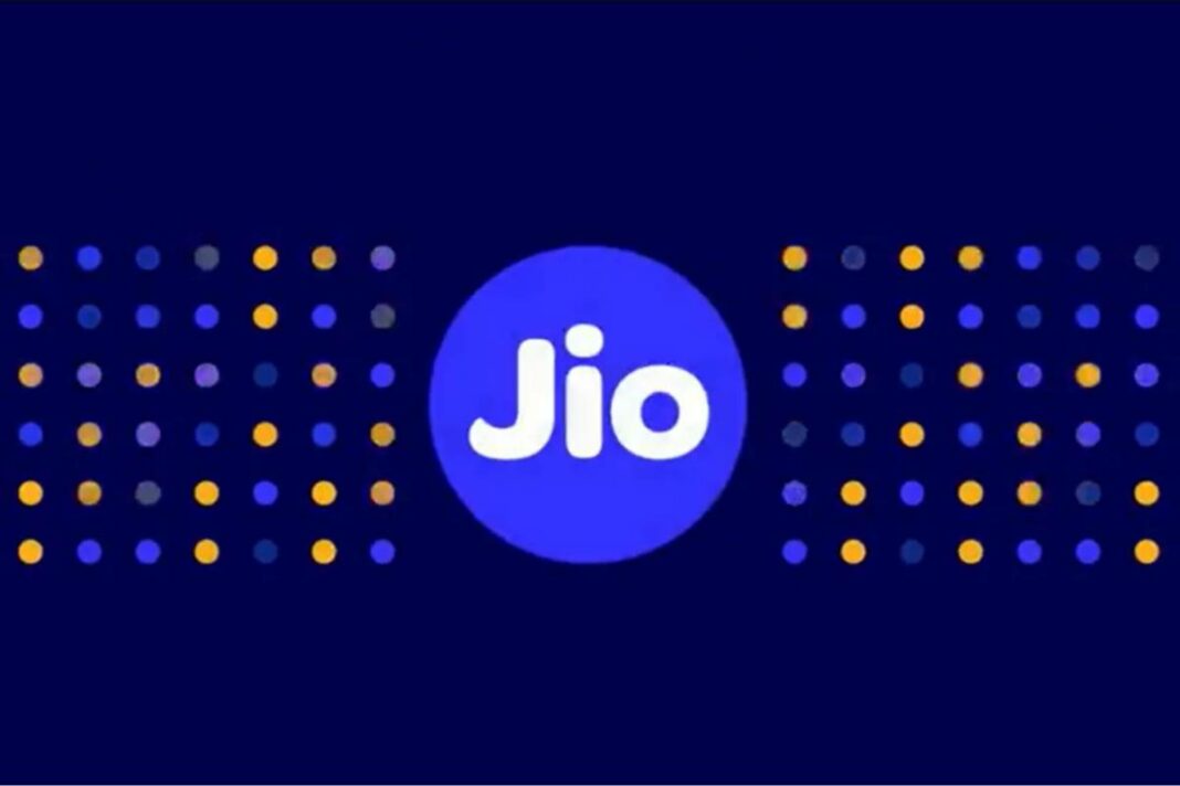 Jio logo with glowing dots on dark blue background.