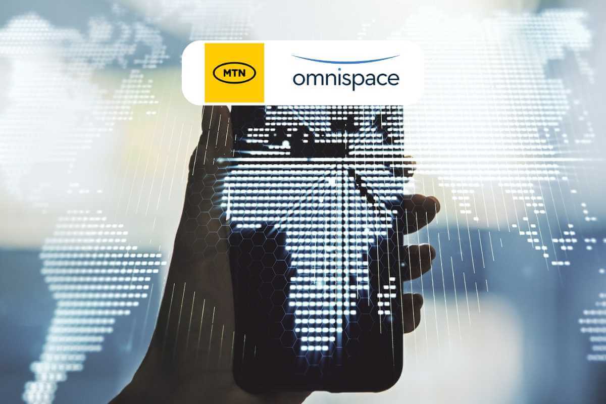 Hand holding phone, digital overlay, MTN Omnispace logos.