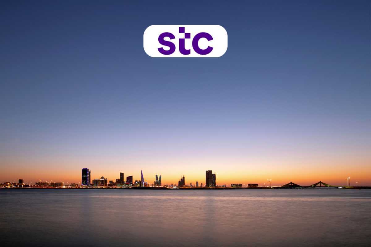 City skyline at dusk with STC logo