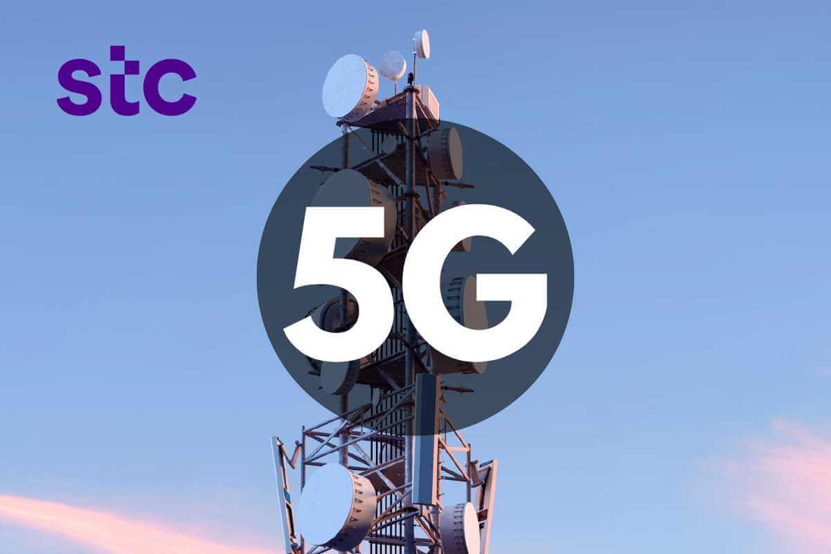 5G network tower at sunset with company logo.