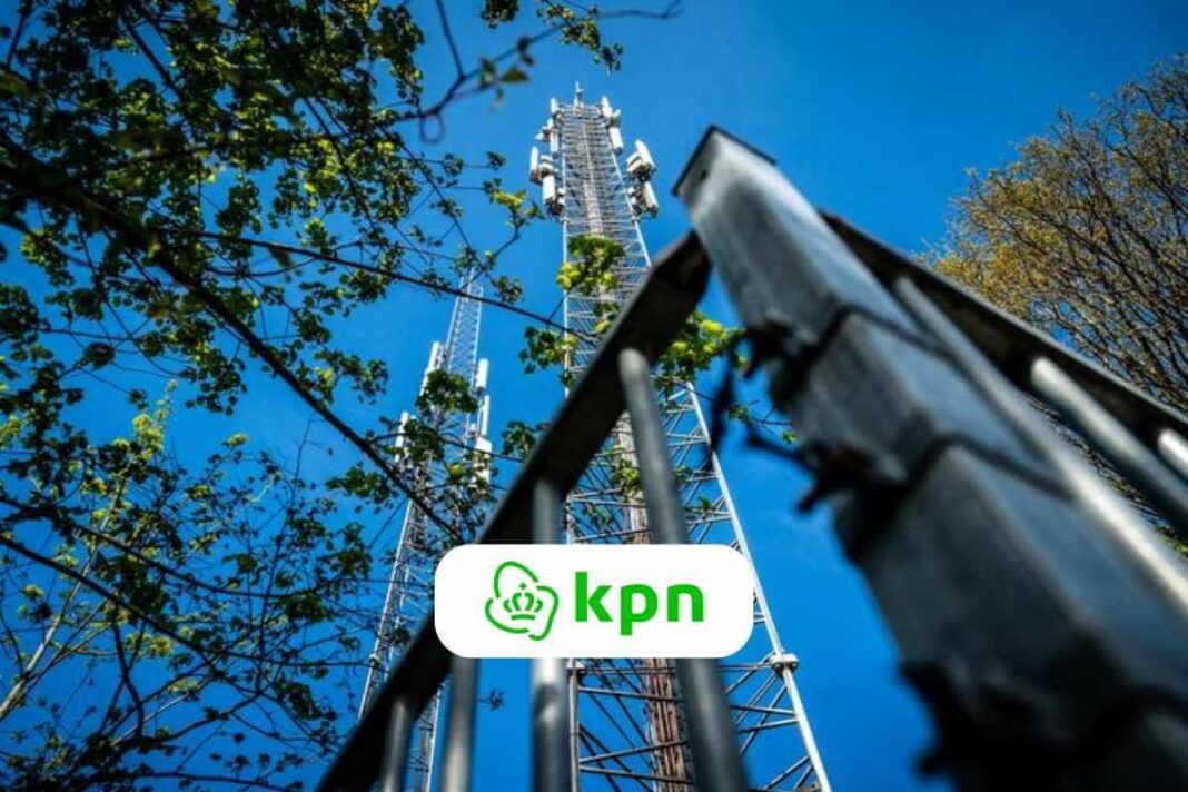 Cell tower among trees with KPN logo visible.