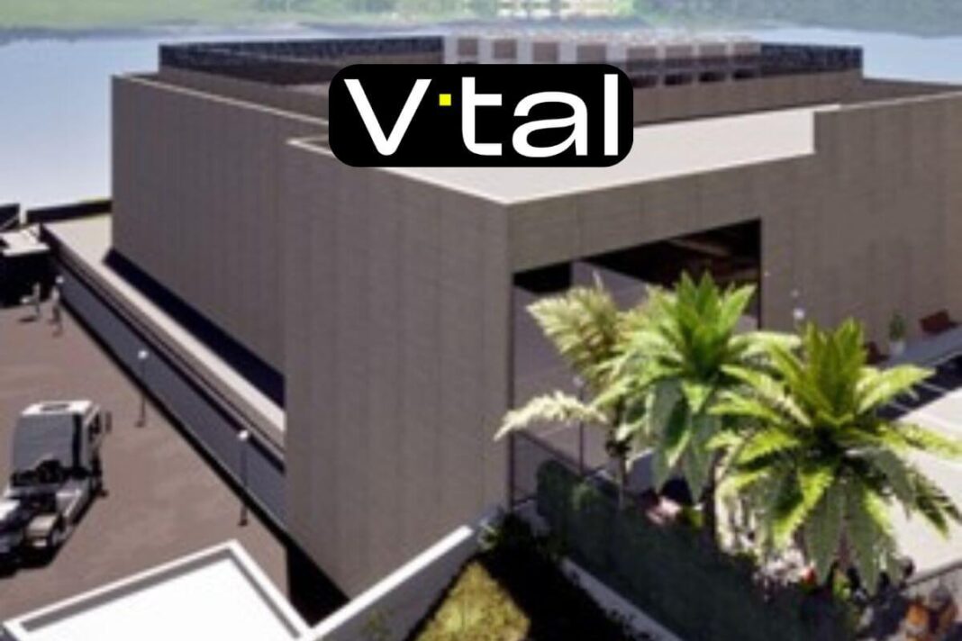 Modern building with 'V•tal' logo and palm trees.
