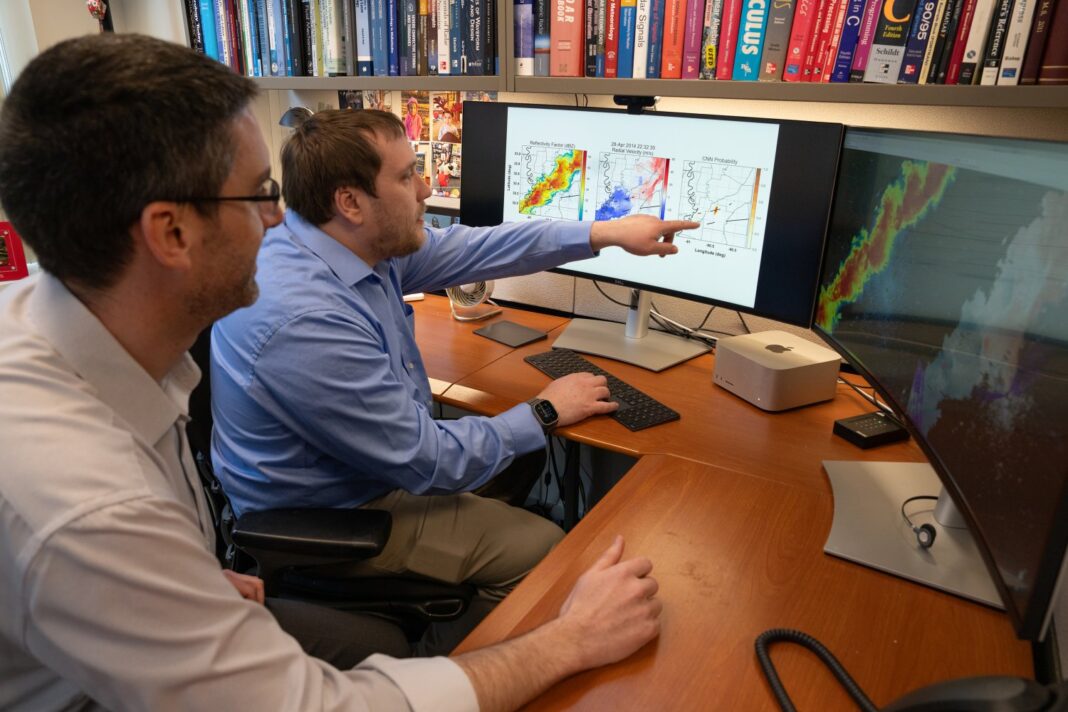 Professionals analyzing data on computer screens.