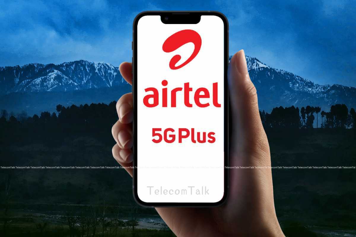 Hand holding smartphone with Airtel 5G Plus logo.
