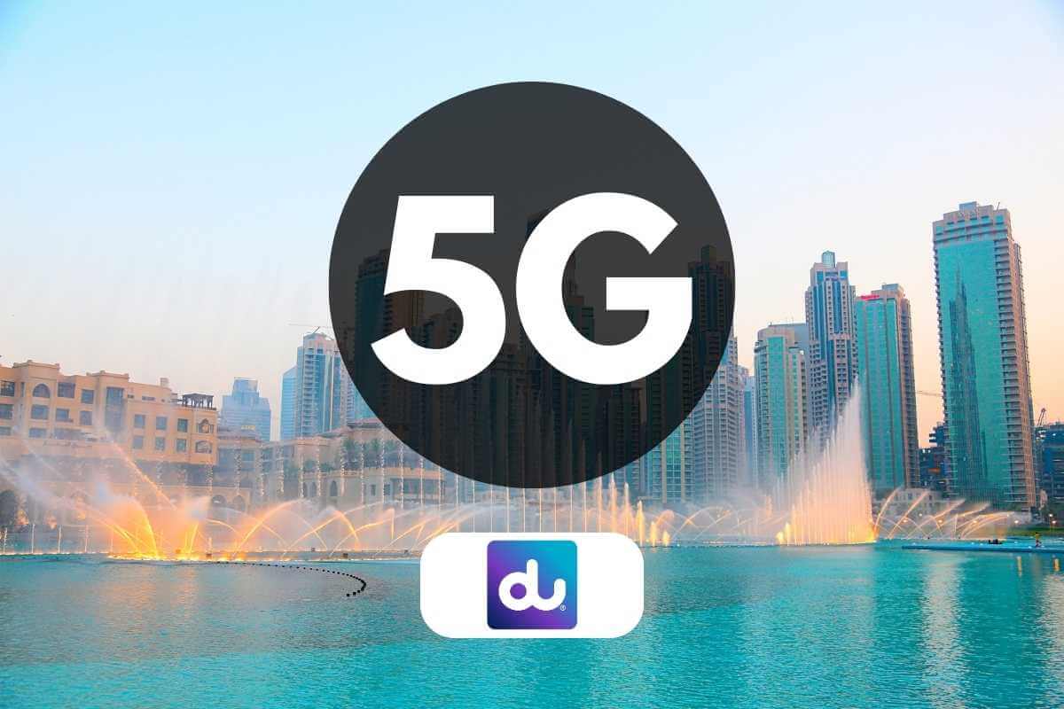 Cityscape with 5G network promotion and fountain show.