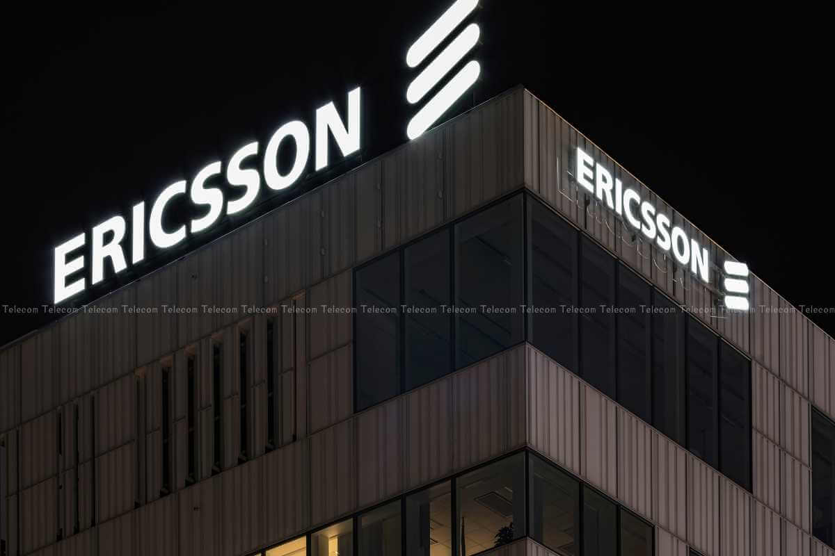 Ericsson corporate building sign illuminated at night