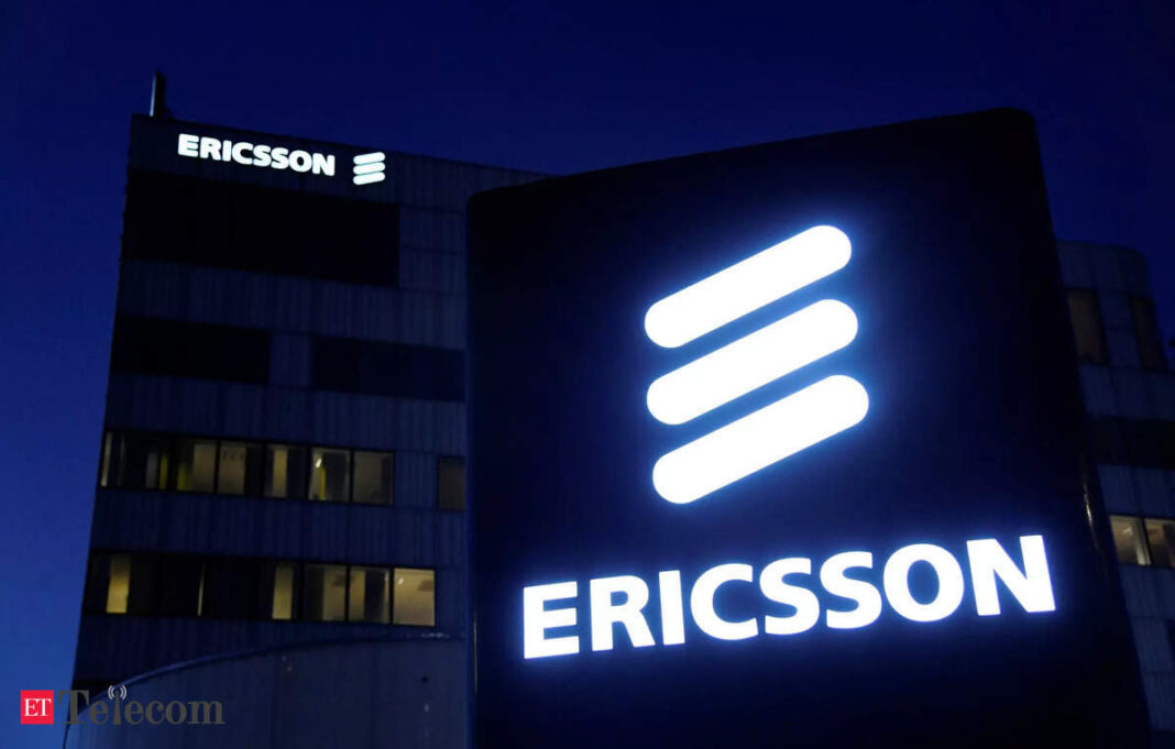 Ericsson logo on building facade at night.