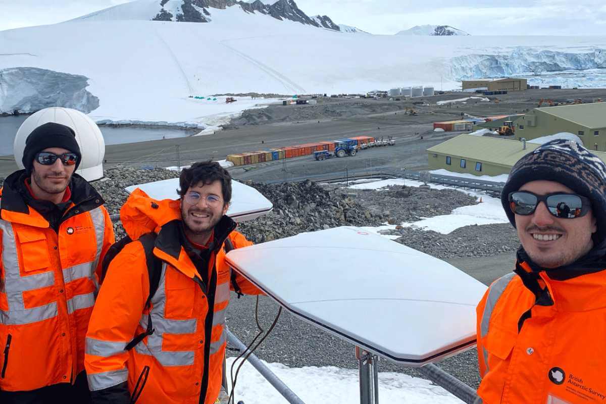 Researchers with equipment in Antarctica.