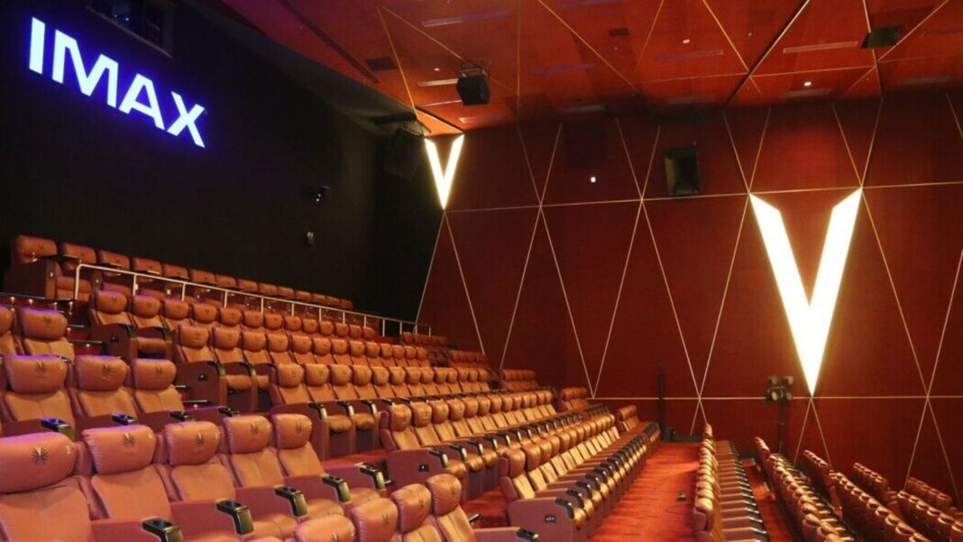 Empty IMAX theater interior with red seats.