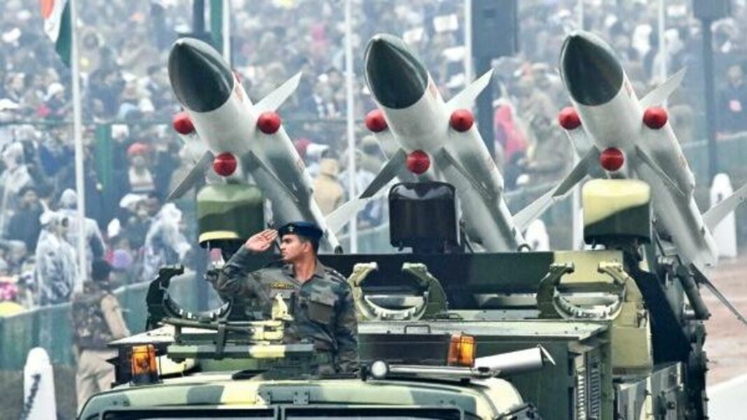 Military parade with missiles and saluting soldier.
