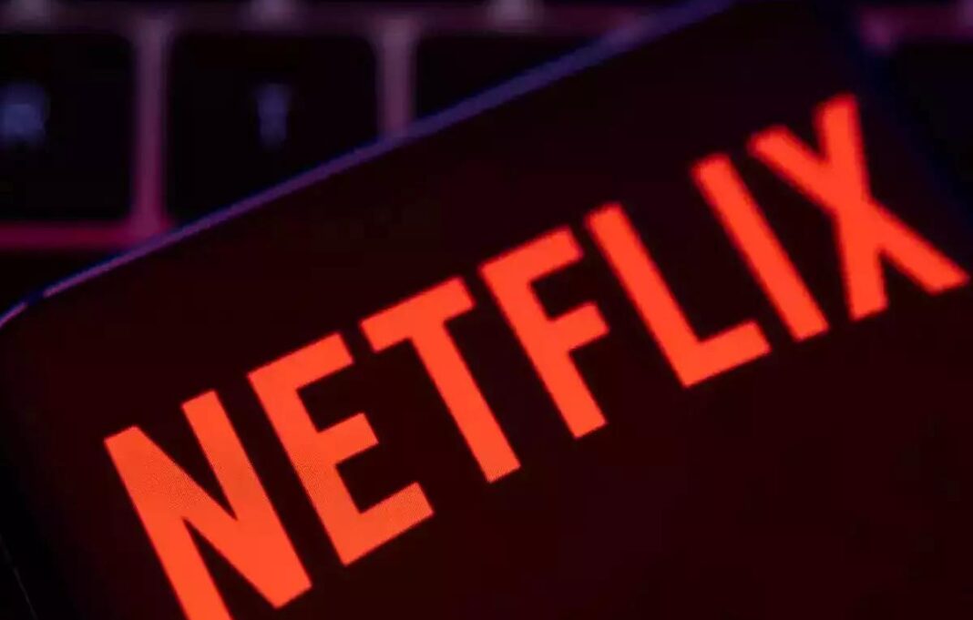 Netflix logo in red neon lights.