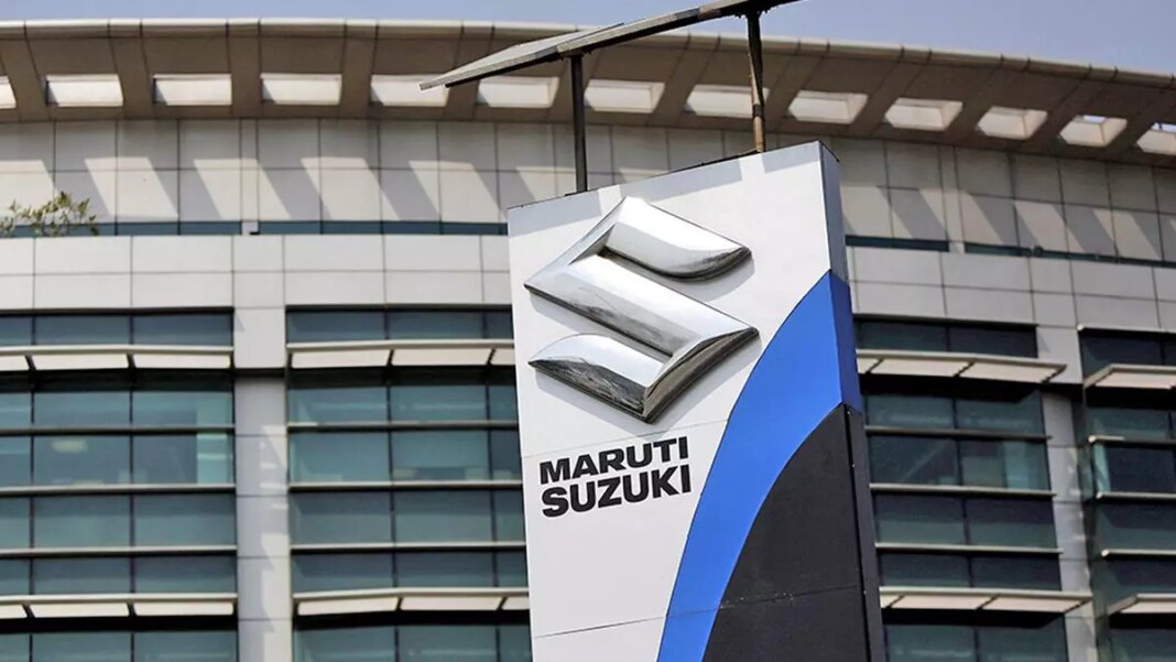 Maruti Suzuki dealership sign with building.