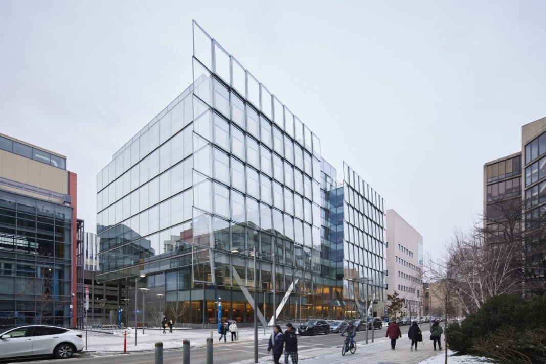 Modern glass building facade, urban street view.
