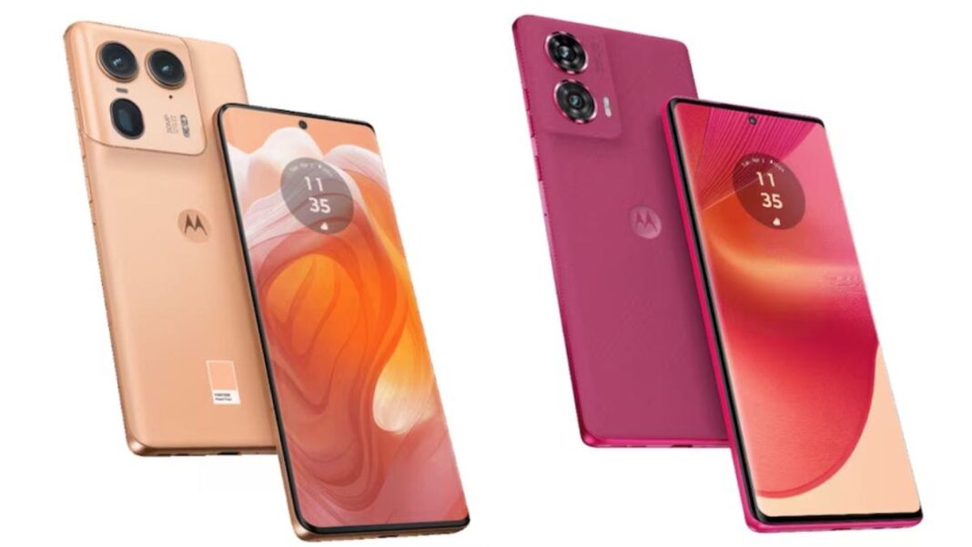 Two Motorola smartphones, one pink, one gold.