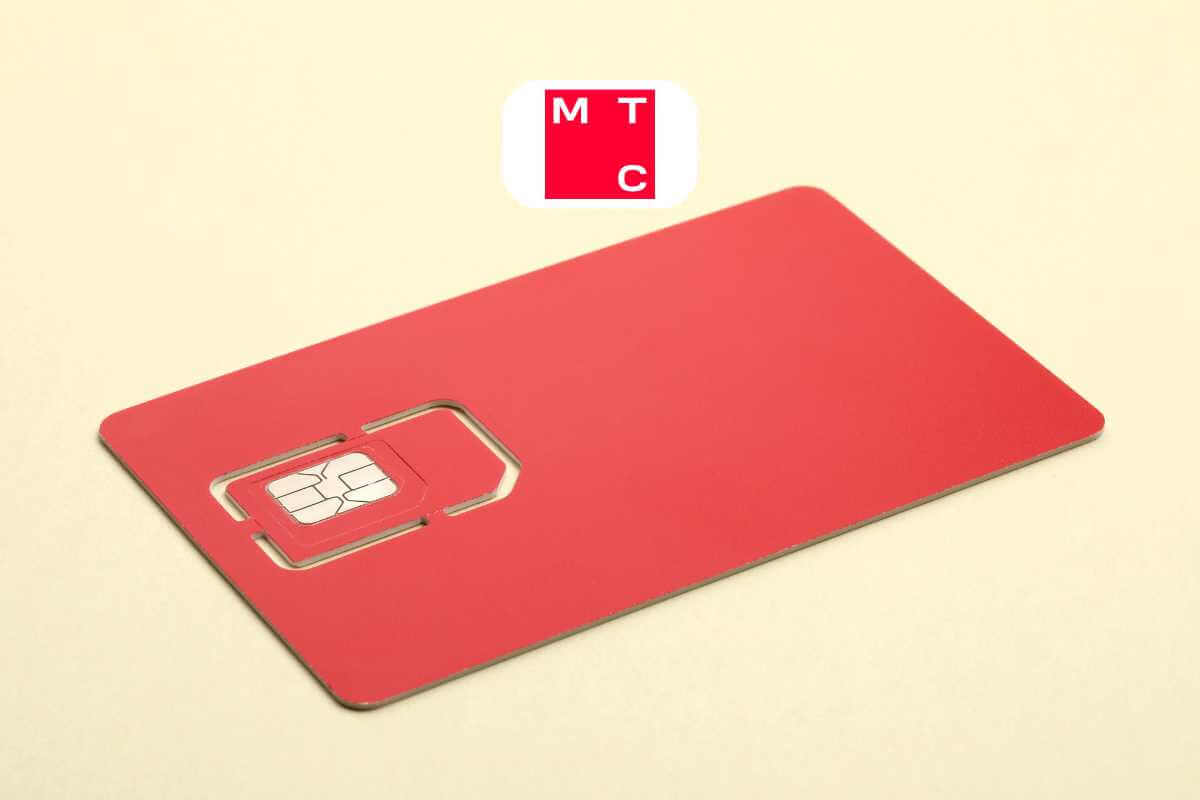Red SIM card on beige background.