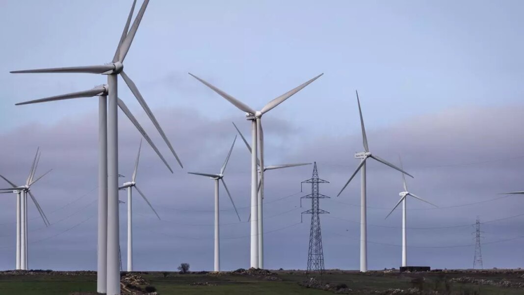 Wind turbines in field for renewable energy.