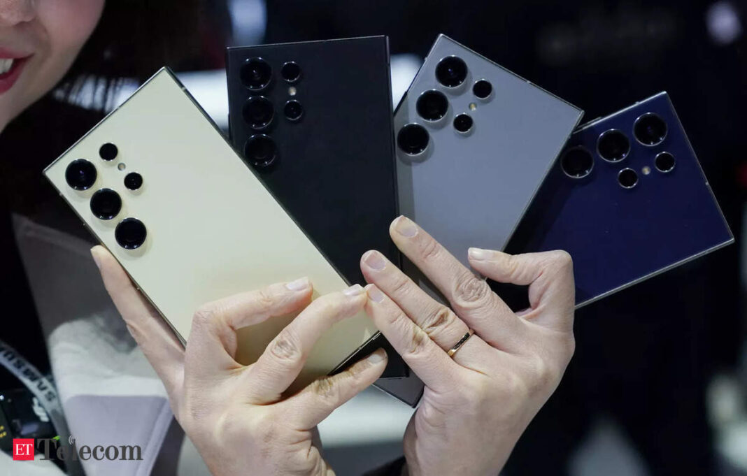 Hands holding latest smartphones with multiple cameras.