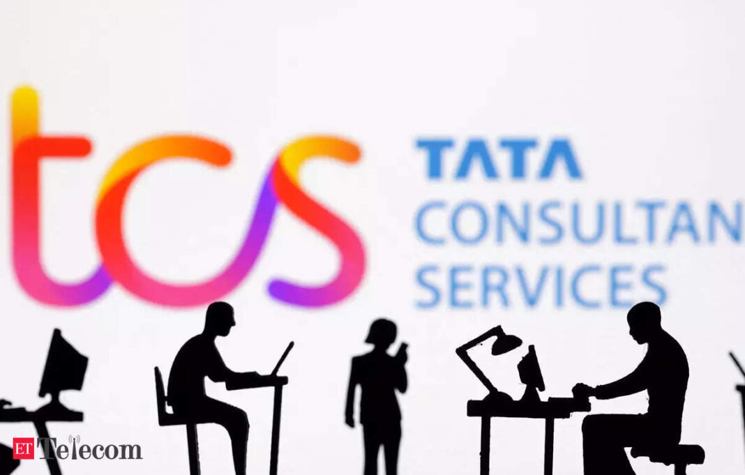 Silhouettes of workers with TCS logo in background.