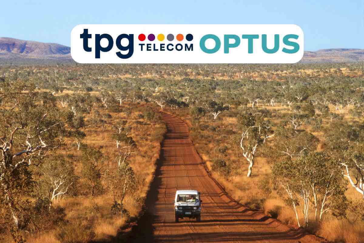 Vehicle driving on remote Australian outback road.