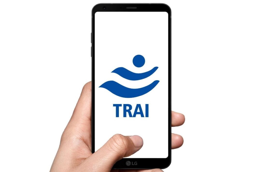 Hand holding smartphone with TRAI logo on screen