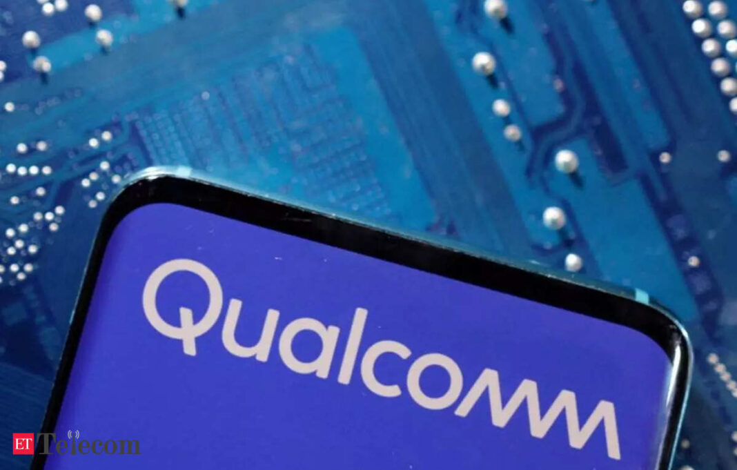 Qualcomm logo on smartphone against circuit board background.