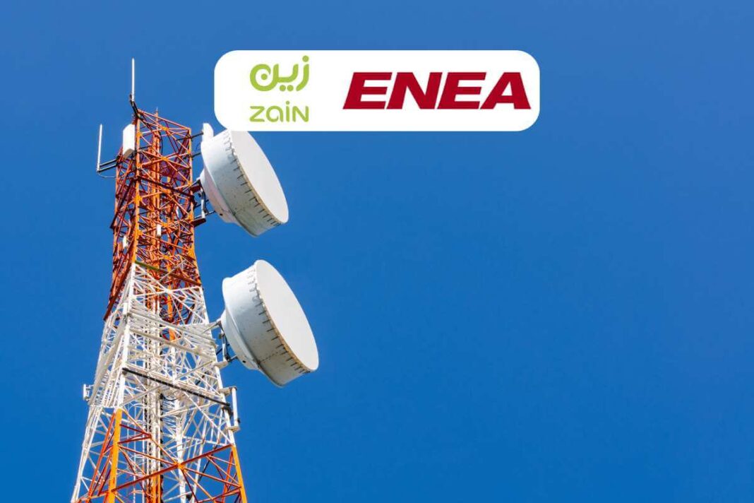Telecom tower with Zain and ENEA logos against sky