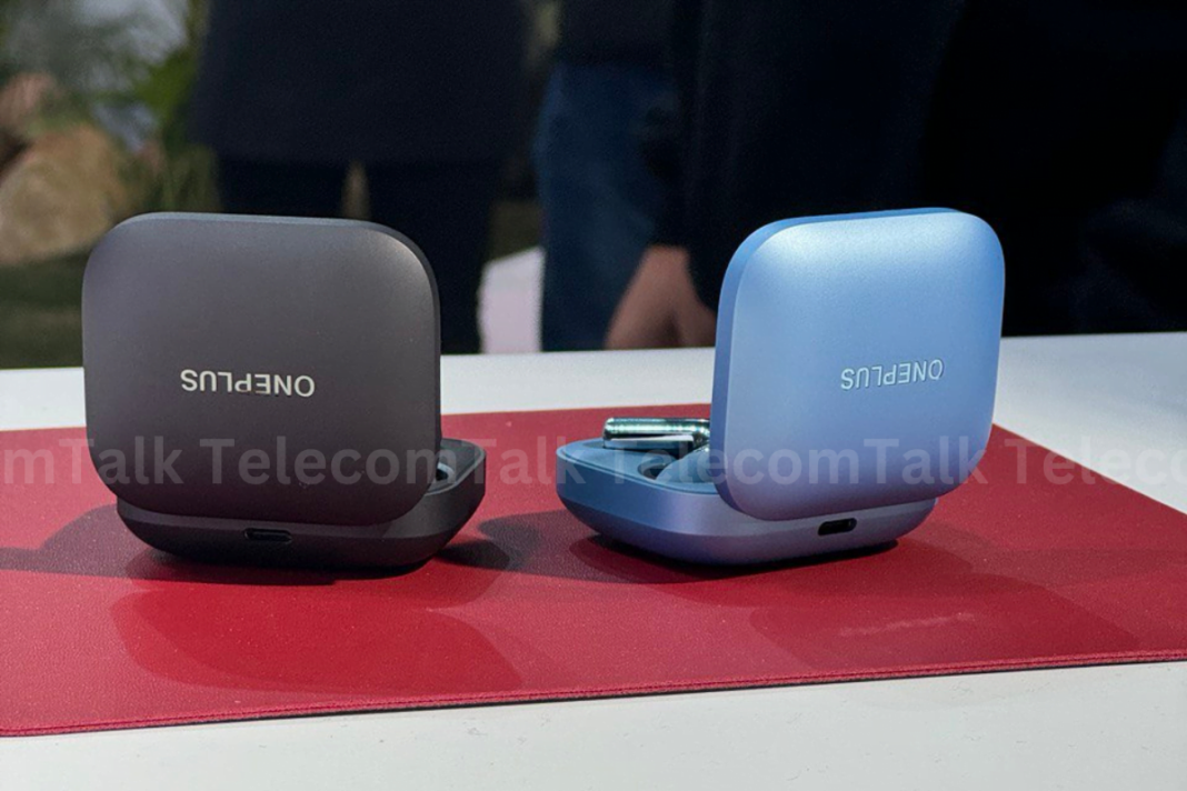 Two wireless earbud cases on table, one opened.