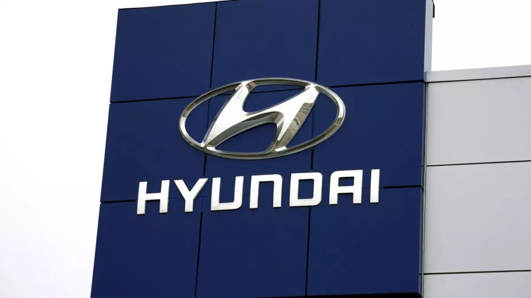 Hyundai logo on dealership building exterior.