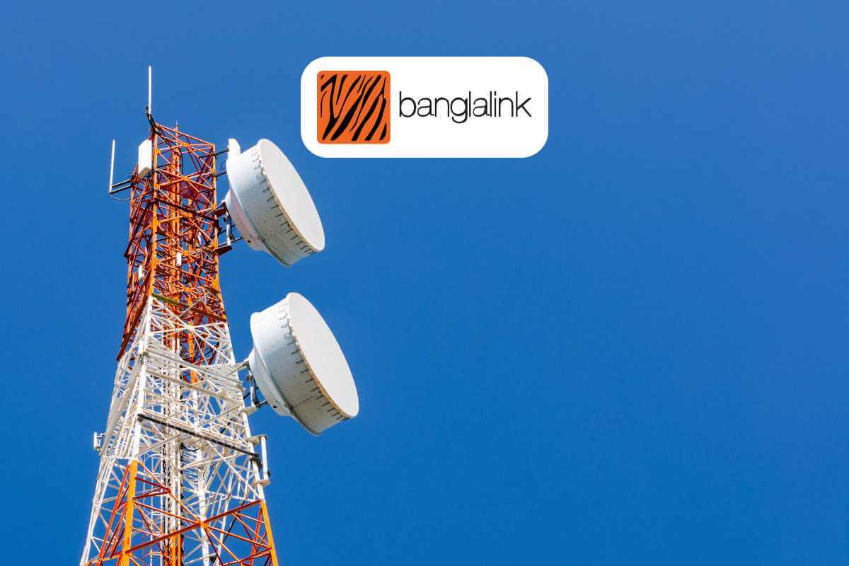 Mobile tower with antennas and company logo against sky.