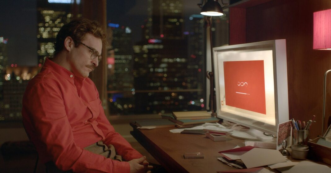 Man sitting by computer in office at night