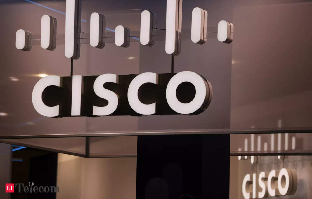 Cisco logo on illuminated signage indoors.