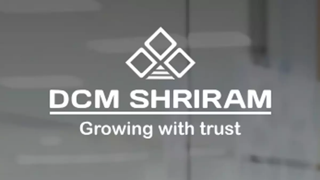 DCM Shriram company logo on glass door.