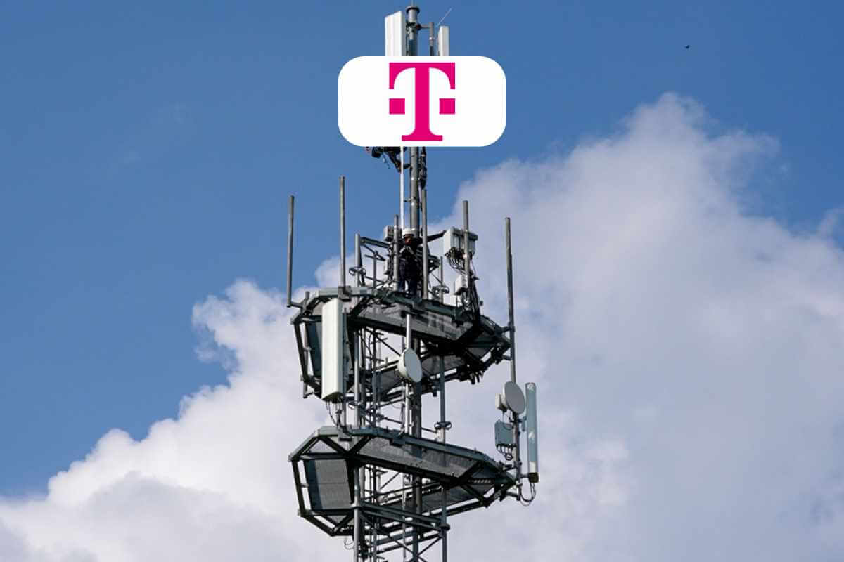 Cell tower against cloudy sky with logo.