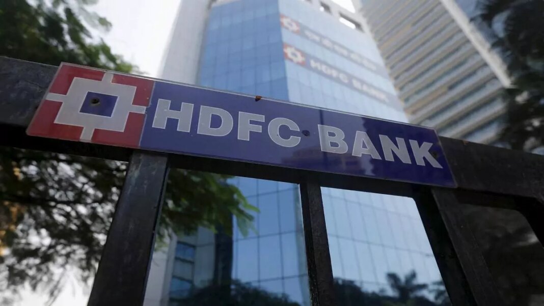 HDFC Bank signboard with office building background.