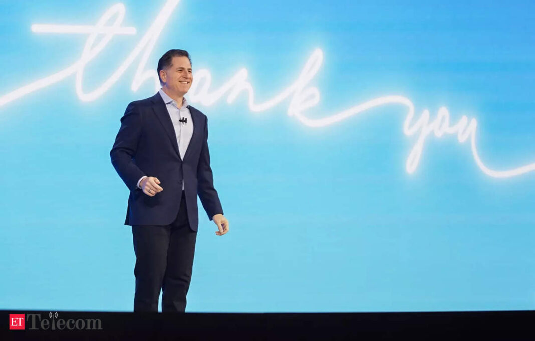Man presenting at conference with "Thank you" backdrop.