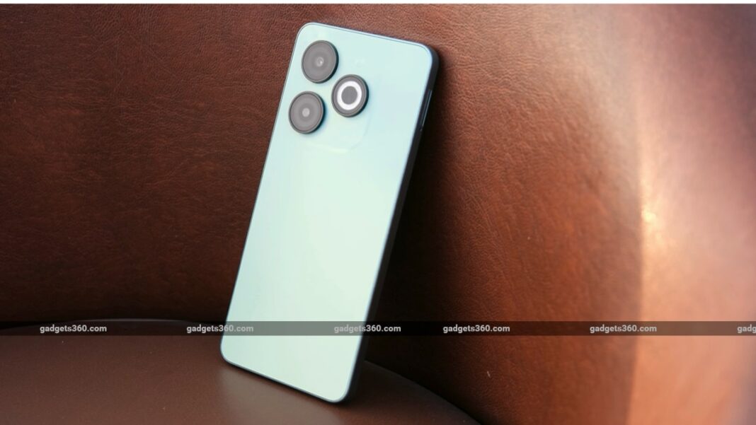 Blue smartphone with dual cameras on brown background.