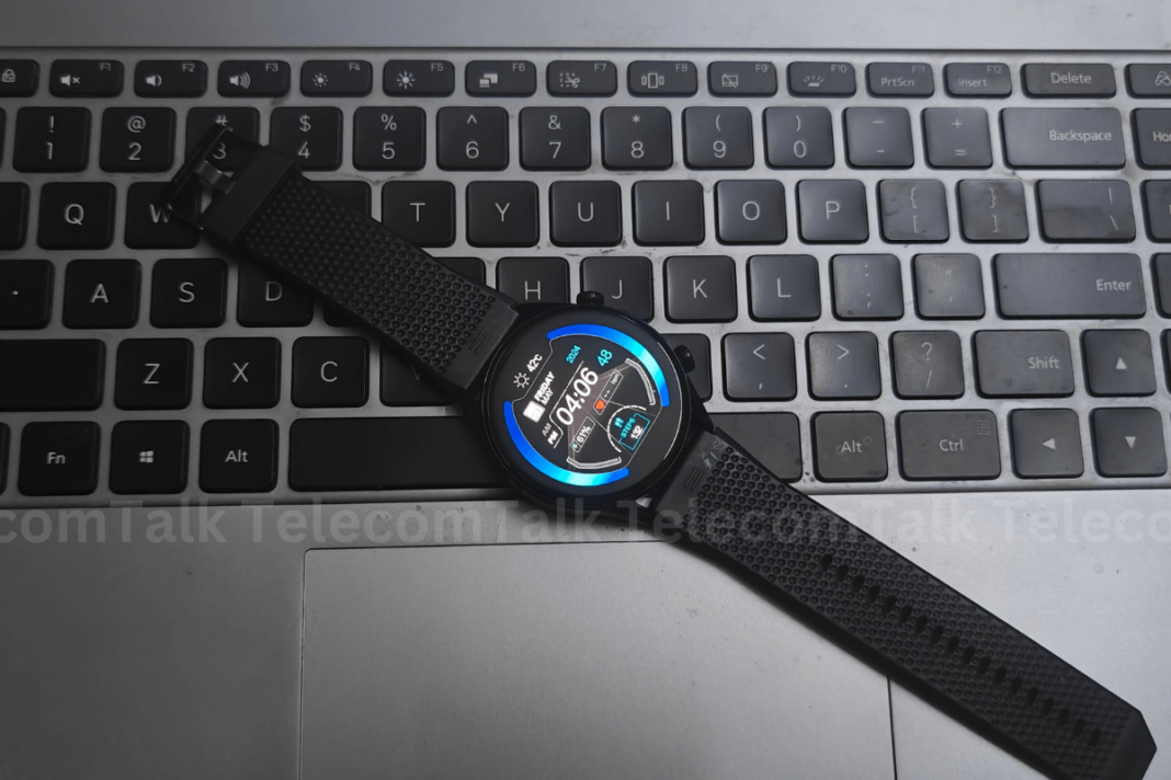Smartwatch on laptop keyboard displaying time and steps.