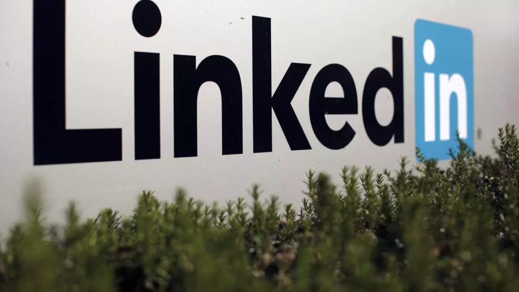 LinkedIn logo behind green shrubbery.