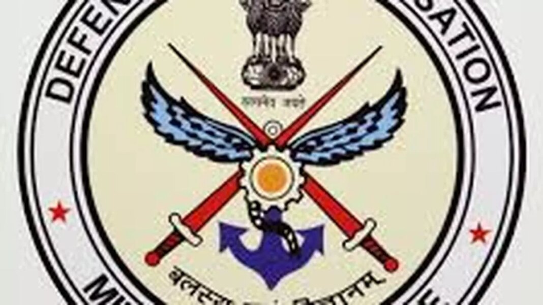 Indian Defense Service emblem with inscriptions.