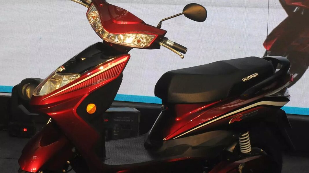 Red and black electric scooter on display