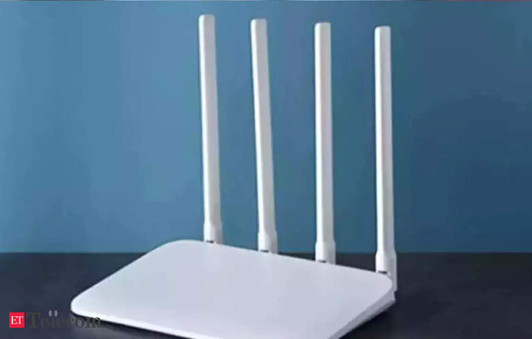 White wireless router with four antennas.