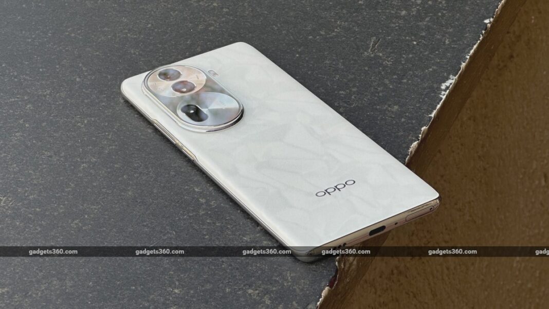 White OPPO smartphone with triple cameras.