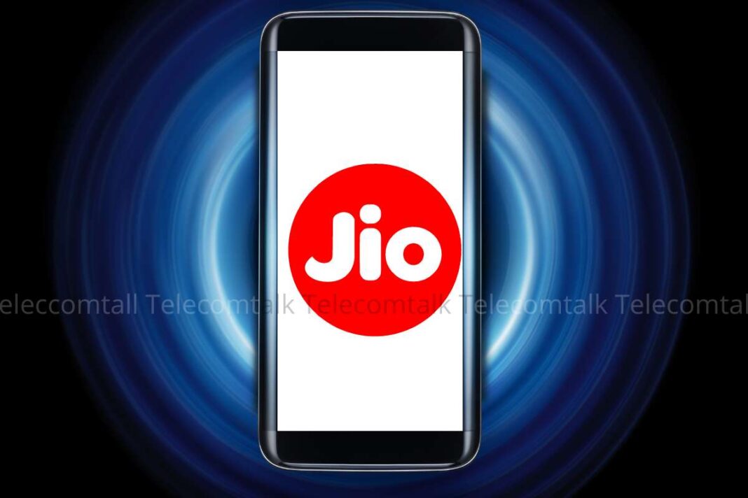 Smartphone with Jio logo on screen, blue swirl background.